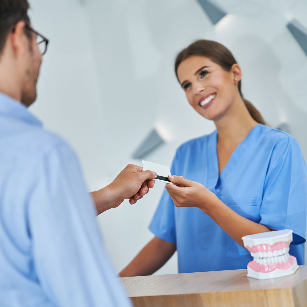 Patient paying for dental services
