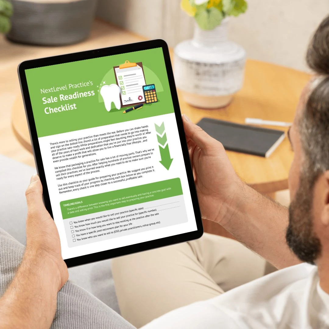 Image of man with tablet displaying the NLP Sales Readiness Checklist PDF